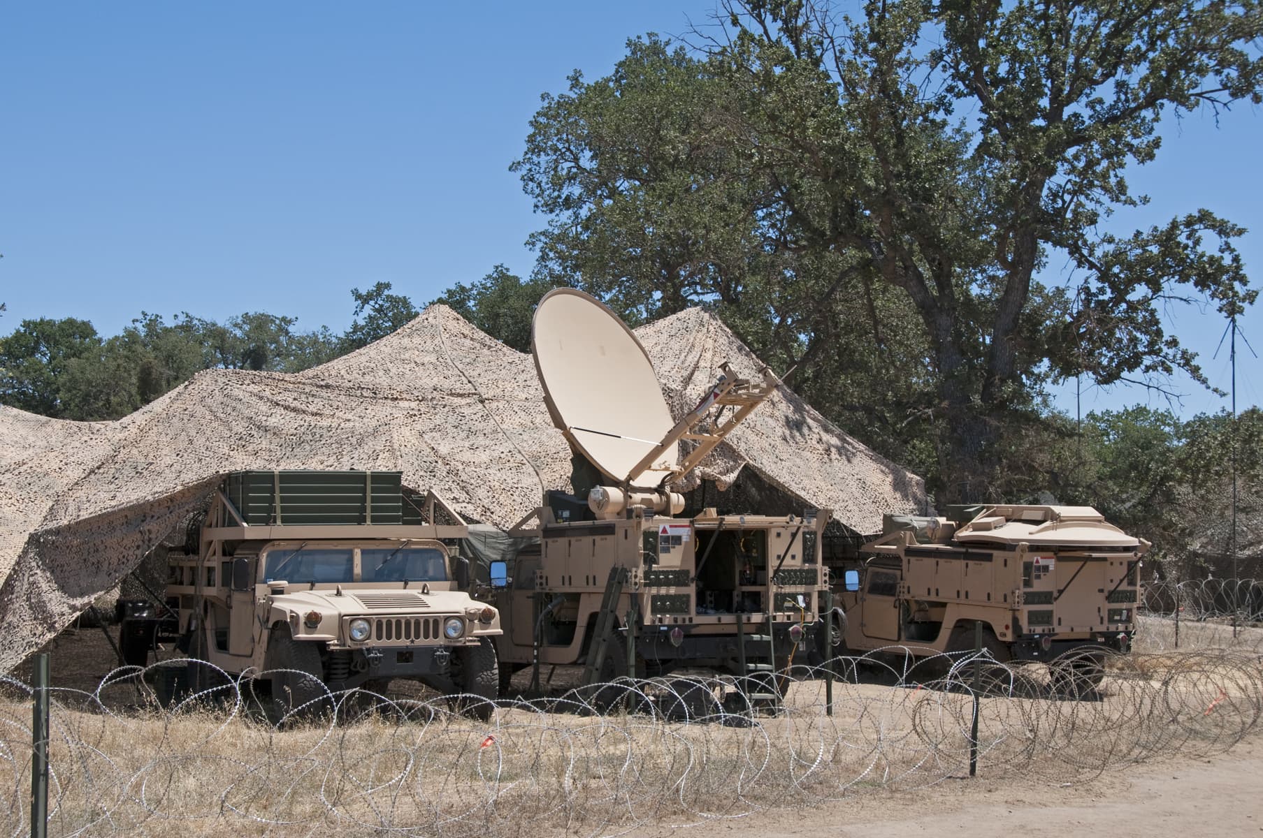 Army satellite communications with desert camouflage